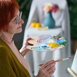Seniors painting activies in senior living community