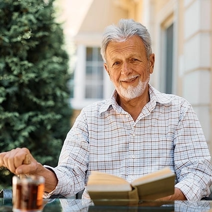 Senior holding a book